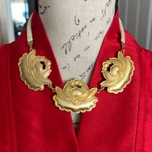 Gorgeous creamy satin ribbon attached to three golden water lilies or possibly